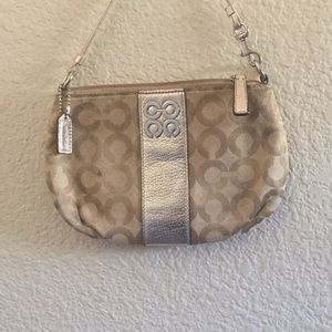 Gold and silver coach purse